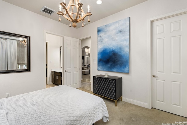 24706 Moorland, San Antonio, TX 78257 - bedroom featuring a chandelier, light carpet, baseboards, and ensuite bathroom