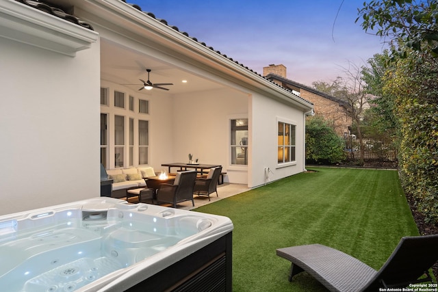 24706 Moorland, San Antonio, TX 78257 - yard at dusk featuring a hot tub, a lawn, a ceiling fan, and a patio area