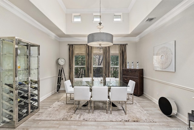 24706 Moorland, San Antonio, TX 78257 - dining space featuring healthy amount of natural light, baseboards, ornamental molding, and light wood-type flooring