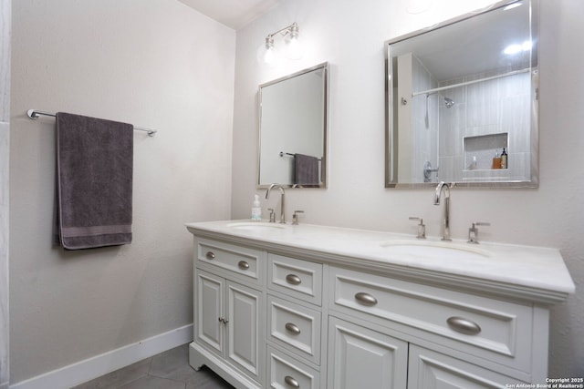6203 Callen Gln, San Antonio, TX 78233 - bathroom featuring double vanity, tile patterned flooring, and baseboards