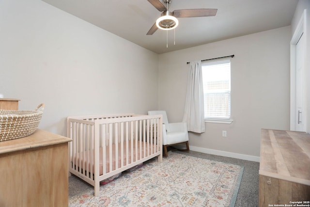 6203 Callen Gln, San Antonio, TX 78233 - carpeted bedroom featuring baseboards, a nursery area, and ceiling fan