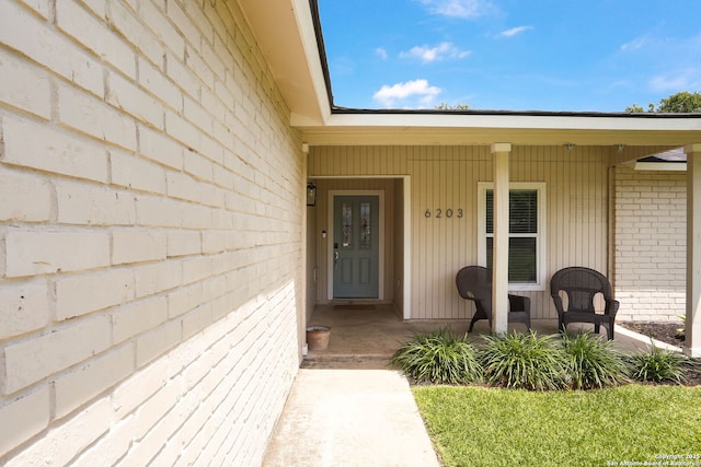 6203 Callen Gln, San Antonio, TX 78233 - doorway to property featuring a porch and brick siding