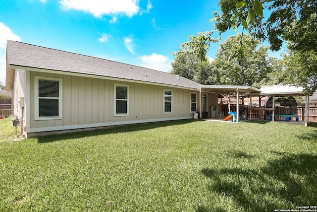6203 Callen Gln, San Antonio, TX 78233 - back of house featuring a playground and roof with shingles