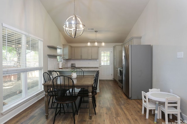 6203 Callen Gln, San Antonio, TX 78233 - dining area featuring a chandelier, vaulted ceiling, and dark wood-type flooring