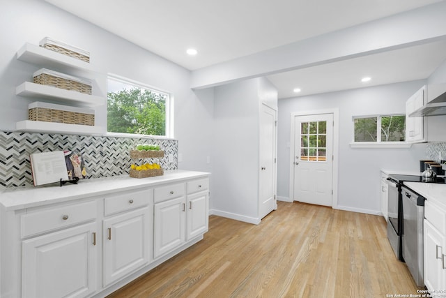 131 New Hvn, San Antonio, TX 78209 - kitchen with decorative backsplash, dishwasher, light countertops, white cabinets, and recessed lighting