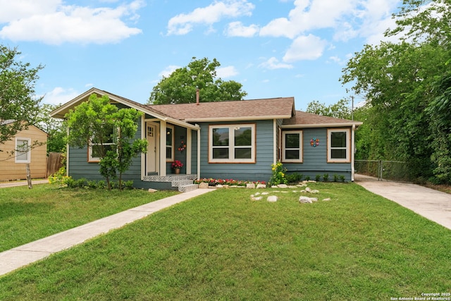 131 New Hvn, San Antonio, TX 78209 - view of front of home with roof with shingles and driveway