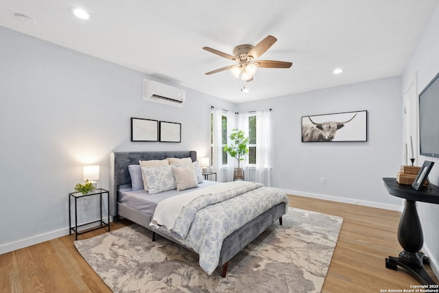 131 New Hvn, San Antonio, TX 78209 - bedroom with a wall mounted air conditioner, light wood-type flooring, recessed lighting, baseboards, and ceiling fan
