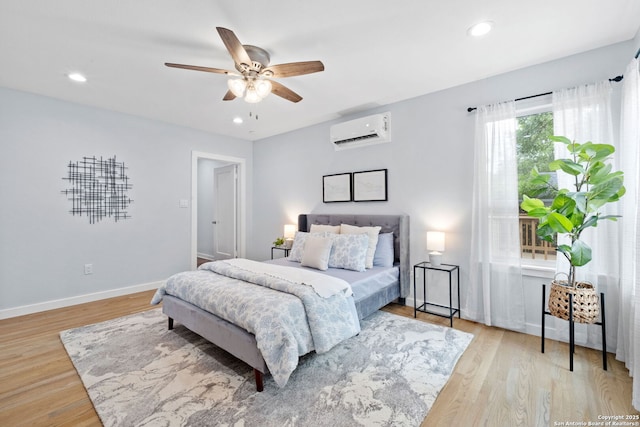 131 New Hvn, San Antonio, TX 78209 - bedroom featuring a wall mounted AC, recessed lighting, light wood-style flooring, baseboards, and ceiling fan