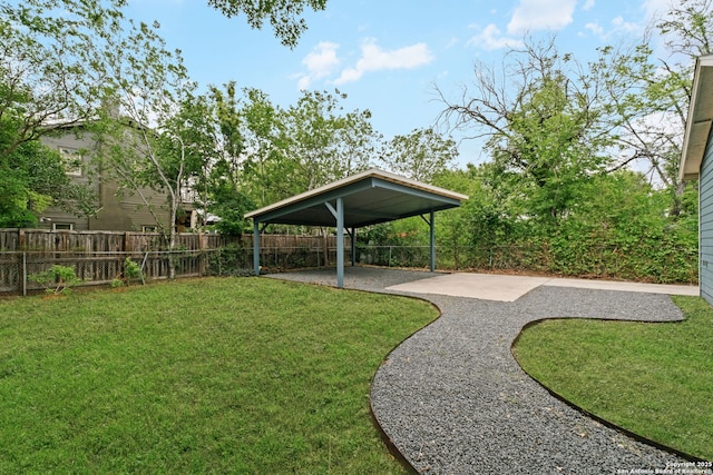 131 New Hvn, San Antonio, TX 78209 - view of yard featuring a patio area and a carport