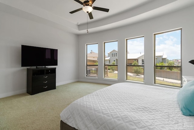 1512 Aubrey Pt, San Antonio, TX 78260 - bedroom featuring carpet floors, a tray ceiling, baseboards, and ceiling fan