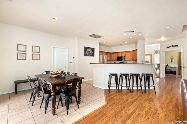 9106 Thomas York, San Antonio, TX 78251 - dining space with light tile patterned floors and recessed lighting
