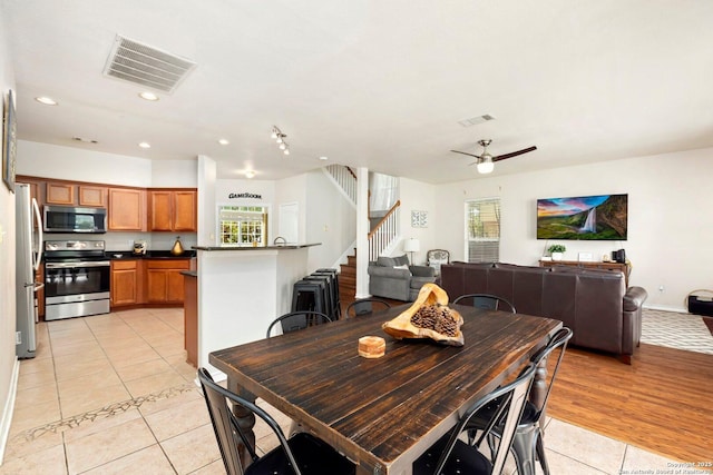 9106 Thomas York, San Antonio, TX 78251 - dining room with light tile patterned floors, stairs, recessed lighting, and a ceiling fan