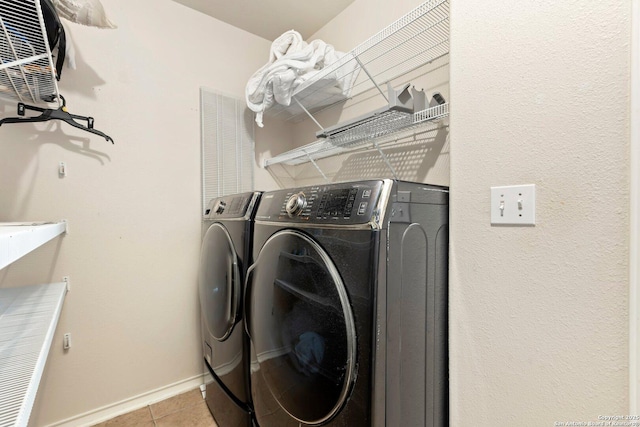9106 Thomas York, San Antonio, TX 78251 - washroom featuring washing machine and clothes dryer and tile patterned flooring