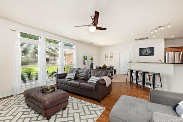 9106 Thomas York, San Antonio, TX 78251 - living area featuring a ceiling fan, light wood-style floors, french doors, and rail lighting