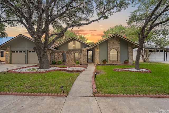 9219 George Kyle St, San Antonio, TX 78240 - mid-century modern home featuring brick siding, driveway, a front lawn, and a garage