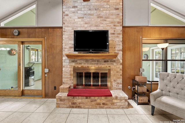 9219 George Kyle St, San Antonio, TX 78240 - living room with wood walls, tile patterned floors, and a fireplace