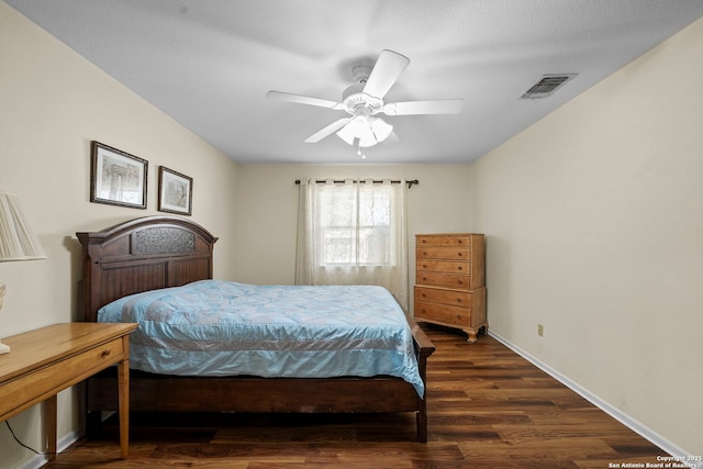 9219 George Kyle St, San Antonio, TX 78240 - bedroom with dark wood-type flooring, ceiling fan, and baseboards