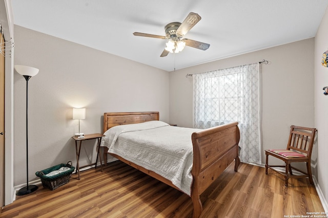9219 George Kyle St, San Antonio, TX 78240 - bedroom with light wood finished floors and ceiling fan