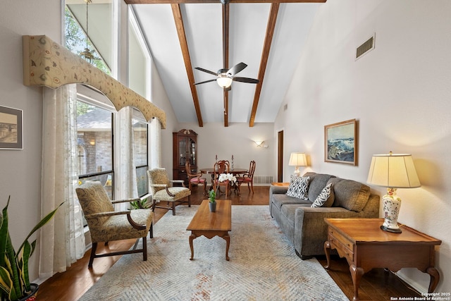 9219 George Kyle St, San Antonio, TX 78240 - living room with high vaulted ceiling, wood finished floors, a ceiling fan, and beamed ceiling