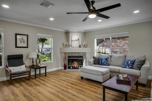 7710 Allison Blf, San Antonio, TX 78240 - living room with crown molding, light wood-style flooring, ceiling fan, a fireplace, and recessed lighting