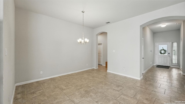 3542 Hurricane, New Braunfels, TX 78130 - unfurnished dining area with arched walkways, a chandelier, and baseboards