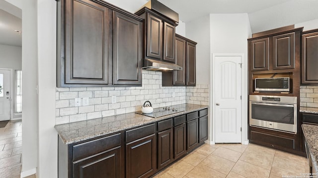 3542 Hurricane, New Braunfels, TX 78130 - kitchen with stainless steel appliances, light stone countertops, decorative backsplash, dark brown cabinets, and under cabinet range hood