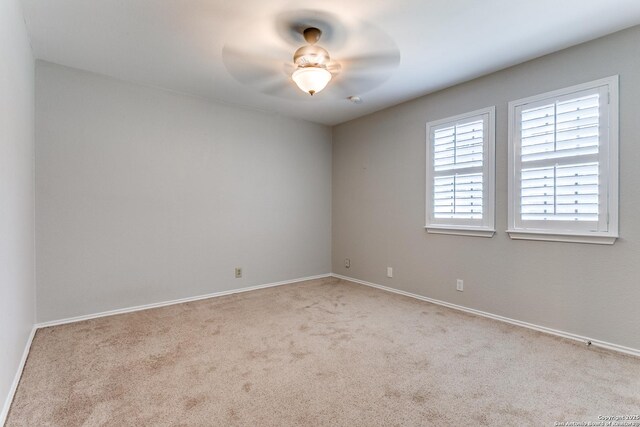18039 Shady Knl, San Antonio, TX 78258 - spare room with carpet flooring, baseboards, and a ceiling fan