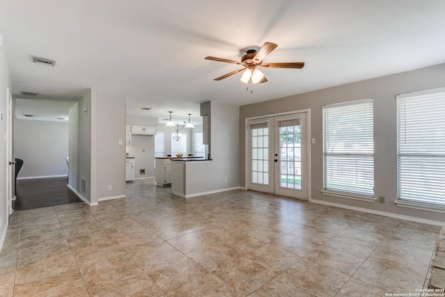 18039 Shady Knl, San Antonio, TX 78258 - unfurnished living room featuring a ceiling fan, french doors, baseboards, and light tile patterned flooring