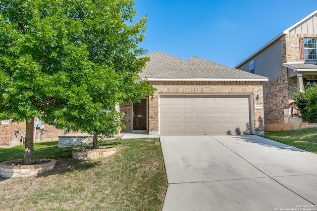 1614 Desert Candle, San Antonio, TX 78245 - view of front of home featuring brick siding, a garage, concrete driveway, roof with shingles, and a front yard