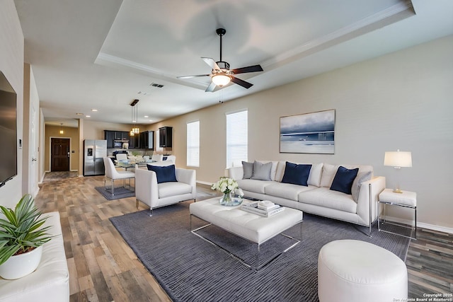 1614 Desert Candle, San Antonio, TX 78245 - living area with a tray ceiling, light wood-type flooring, ceiling fan, recessed lighting, and ornamental molding