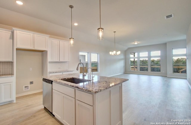 1752 Heritage Maples, New Braunfels, TX 78132 - kitchen with dishwasher, a sink, light wood-style floors, tasteful backsplash, and recessed lighting