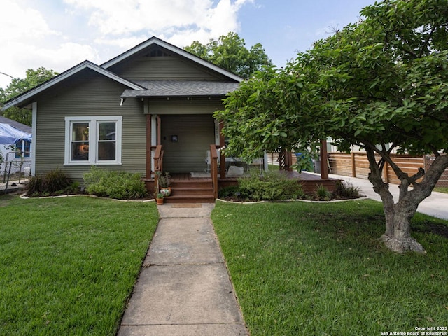 211 W High Ave, San Antonio, TX 78210 - view of front of property with covered porch and roof with shingles