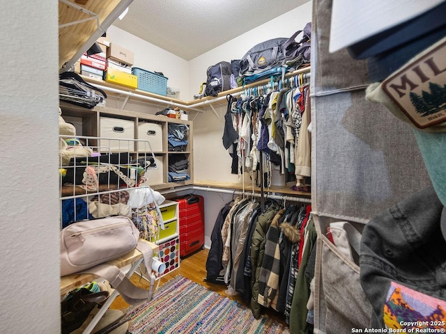 211 W High Ave, San Antonio, TX 78210 - spacious closet with wood finished floors