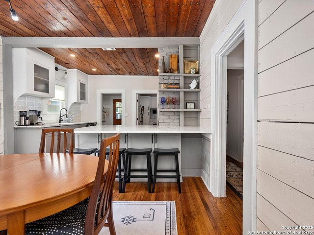 211 W High Ave, San Antonio, TX 78210 - dining room with wood ceiling, wood finished floors, and recessed lighting