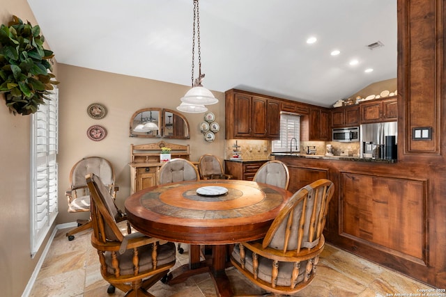 8826 Lost Bnd, San Antonio, TX 78240 - dining room featuring baseboards, stone tile floors, lofted ceiling, and recessed lighting