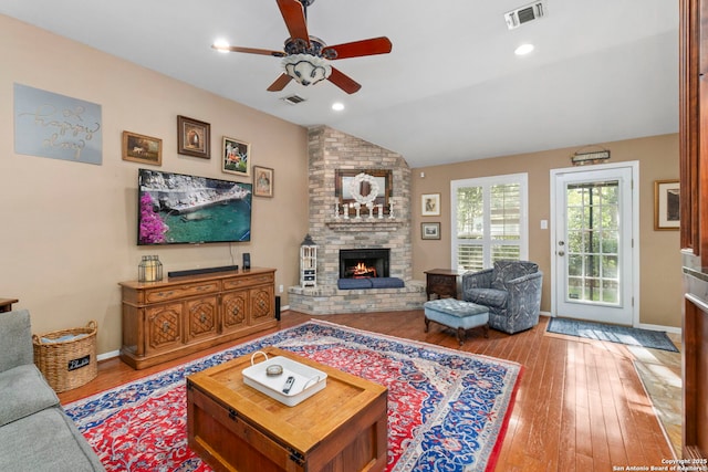 8826 Lost Bnd, San Antonio, TX 78240 - living area with ceiling fan, vaulted ceiling, wood-type flooring, a fireplace, and baseboards