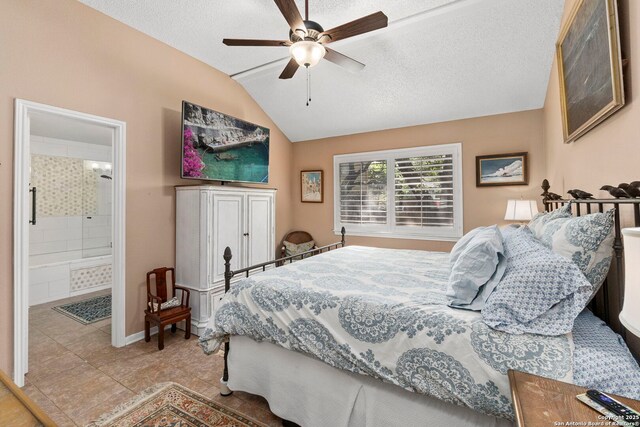 8826 Lost Bnd, San Antonio, TX 78240 - tiled bedroom with vaulted ceiling, ensuite bathroom, a ceiling fan, and a textured ceiling