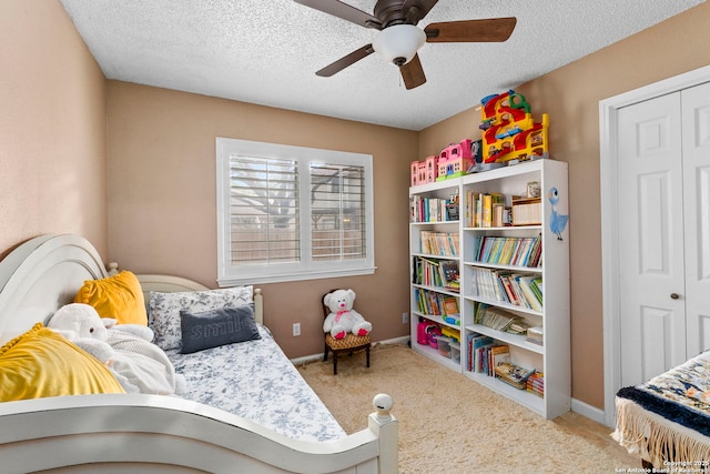 8826 Lost Bnd, San Antonio, TX 78240 - bedroom with carpet, a closet, a textured ceiling, and ceiling fan