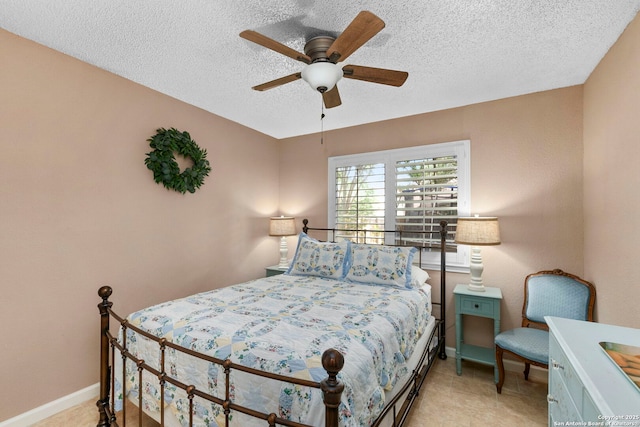8826 Lost Bnd, San Antonio, TX 78240 - bedroom with a textured ceiling, baseboards, and ceiling fan