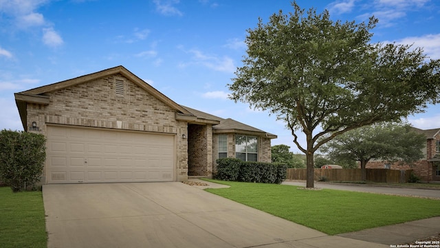 125 Wright Cv, Cibolo, TX 78108 - view of front of property with concrete driveway, an attached garage, and brick siding