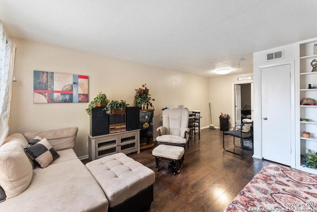 6611 Southpoint St Unit B124, San Antonio, TX 78229 - living room with dark wood-style floors, a textured ceiling, and baseboards