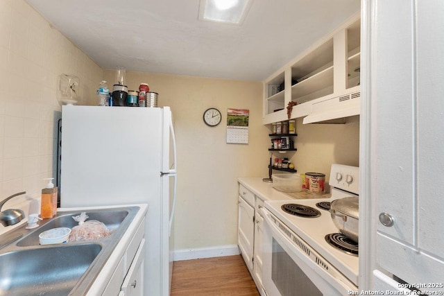 6611 Southpoint St Unit B124, San Antonio, TX 78229 - kitchen with white appliances, a sink, white cabinets, light countertops, and light wood-style flooring