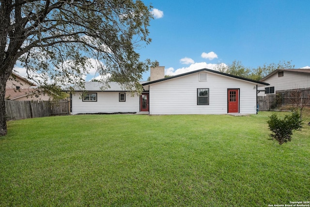 9723 Five Forks St, San Antonio, TX 78245 - back of property featuring a chimney