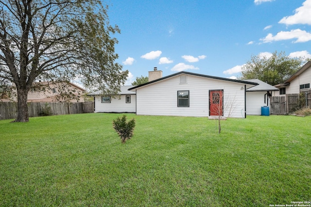 9723 Five Forks St, San Antonio, TX 78245 - back of property featuring a chimney