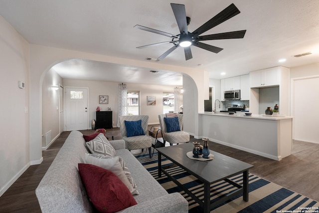 9723 Five Forks St, San Antonio, TX 78245 - living area featuring arched walkways, dark wood-style flooring, a ceiling fan, and recessed lighting