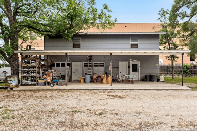 571 Houston, New Braunfels, TX 78130 - rear view of property featuring a patio, an attached garage, driveway, and ceiling fan