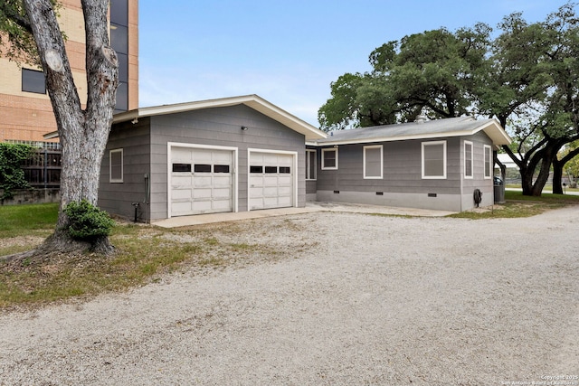 571 Houston, New Braunfels, TX 78130 - view of front of home with crawl space, driveway, and an attached garage