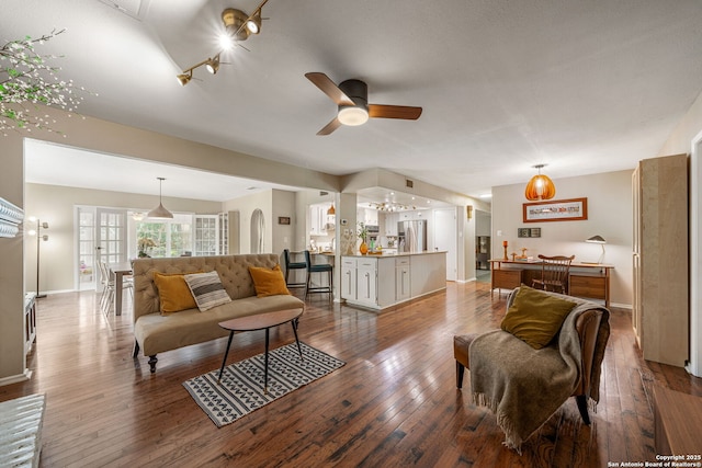 308 Sagecrest, Hollywood Park, TX 78232 - living room featuring ceiling fan, wood-type flooring, and baseboards