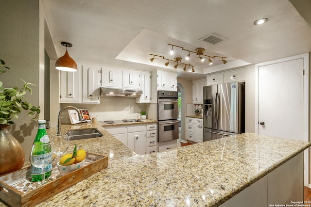 308 Sagecrest, Hollywood Park, TX 78232 - kitchen with appliances with stainless steel finishes, a sink, under cabinet range hood, light stone counters, and white cabinets