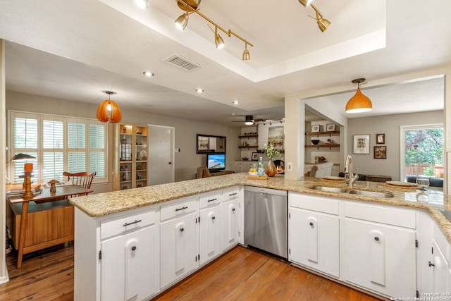 308 Sagecrest, Hollywood Park, TX 78232 - kitchen with dishwasher, a sink, light wood-type flooring, a peninsula, and white cabinetry